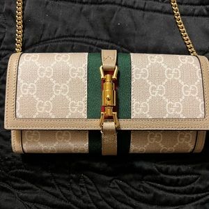 Gucci Jackie 1961 chain link wallet. Never worn. Brand new. Comes with box.